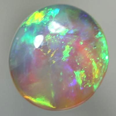 SOLID CRYSTAL OPAL Rolling flashes of orange and green fire 